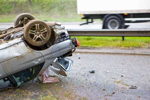 Close-up,Shot,Of,The,Trunk,Of,A,Car,Lying,Upside - Queens Rollover Accident Attorney