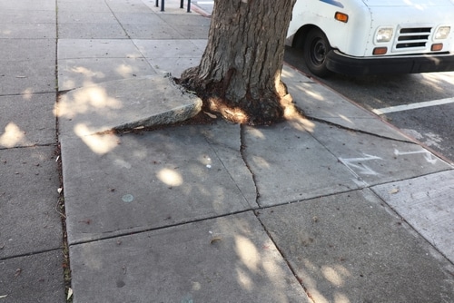 Uneven Sidewalk Injury in New York Queens Slip & Fall Lawyers